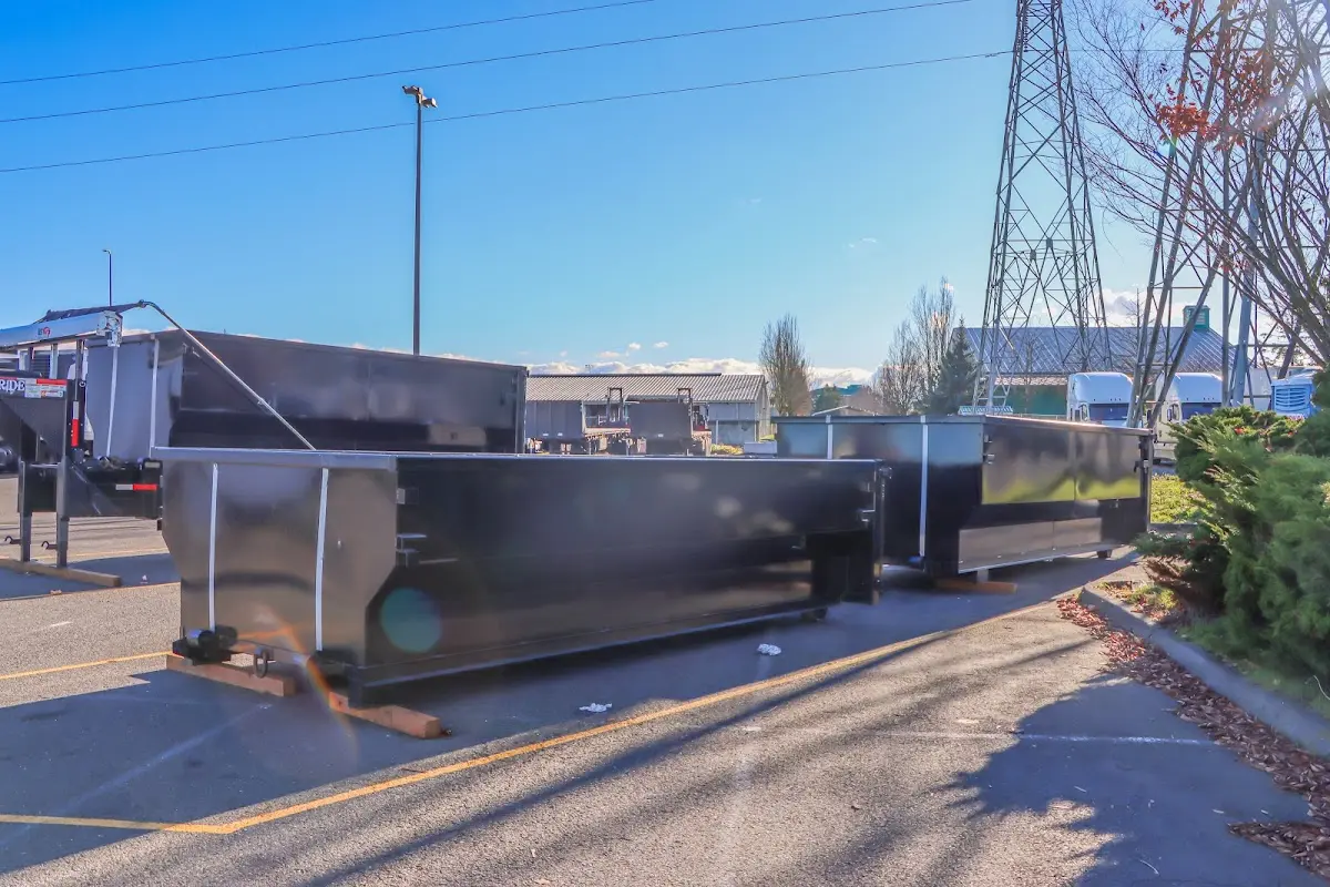 Roll-off dumpster ready for waste disposal at job site for 3 Yard Dumpster Rental in Pleasant Run